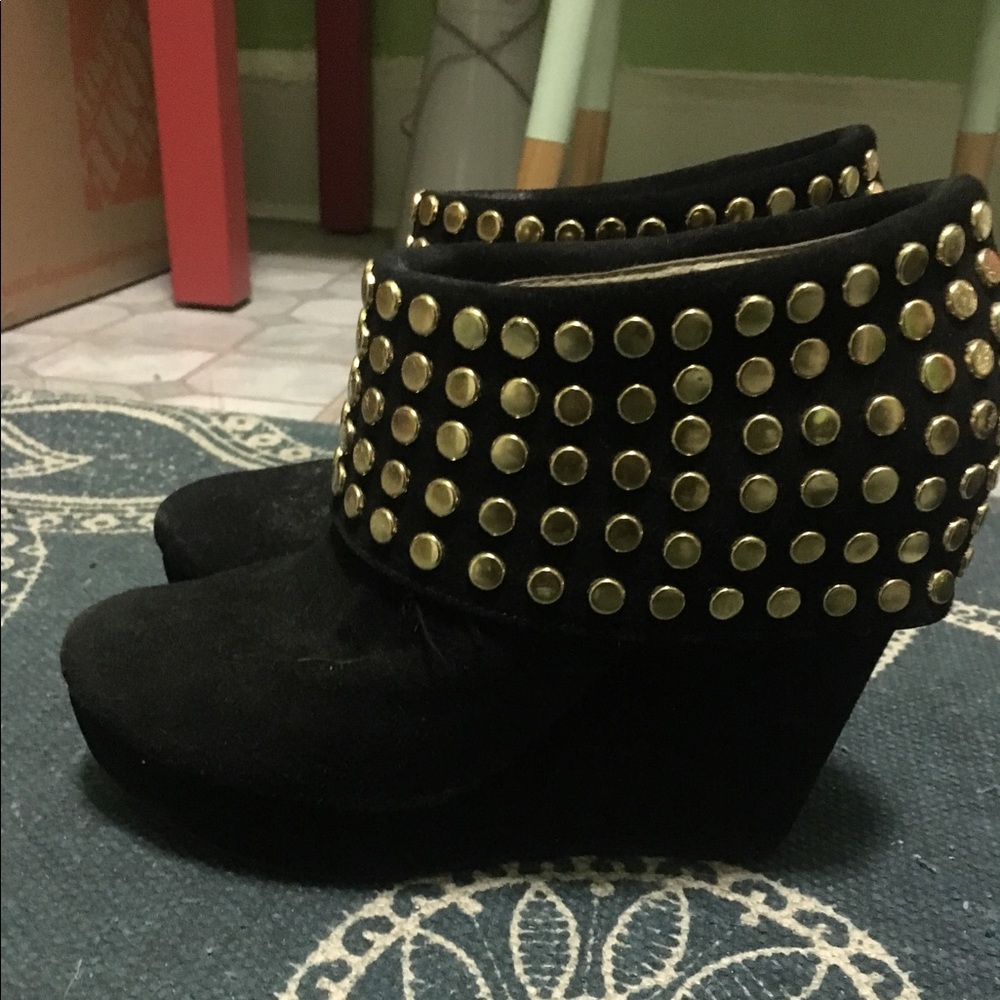 Black suede booties with gold detail